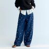 A stylish wide-leg denim pant featuring delicate hand-applied crystal details on the front for a subtle touch of sparkle. Designed with patch pockets at the back and finished with TNS embroidery on the waistband, it combines casual comfort with refined, unique details.  Model: Height 176 cm. Is wearing size S  Made in India  Color Collection: Blue Denim  100% Cotton