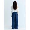 A stylish wide-leg denim pant featuring delicate hand-applied crystal details on the front for a subtle touch of sparkle. Designed with patch pockets at the back and finished with TNS embroidery on the waistband, it combines casual comfort with refined, unique details.  Model: Height 176 cm. Is wearing size S  Made in India  Color Collection: Blue Denim  100% Cotton